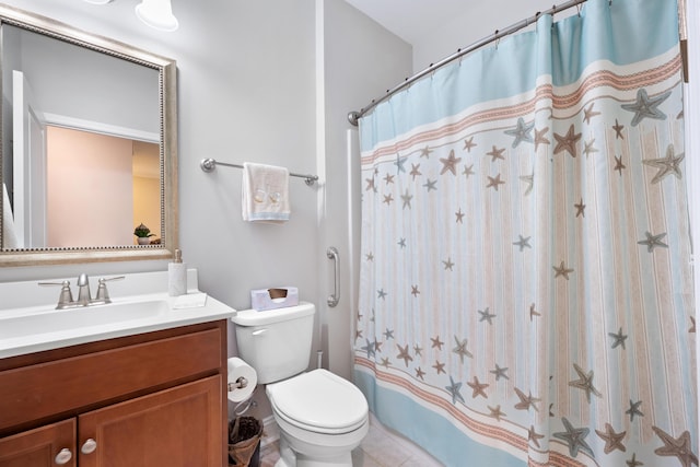 bathroom featuring vanity, curtained shower, and toilet