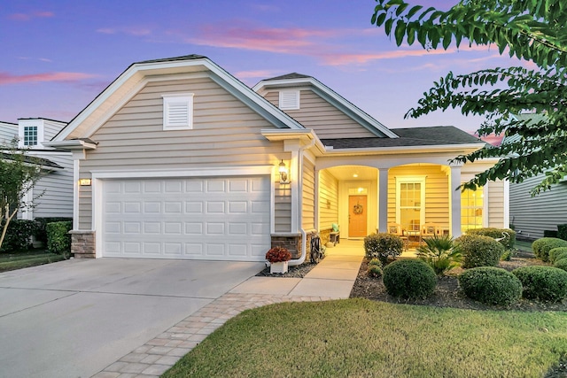 view of front facade featuring a garage and a porch