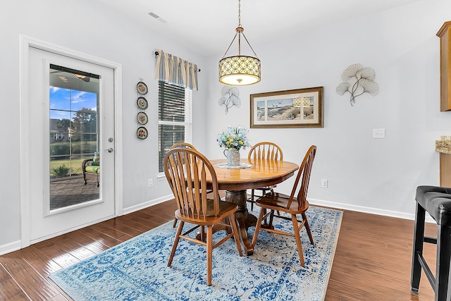 dining room with dark hardwood / wood-style floors