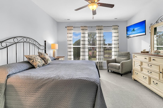 bedroom featuring light carpet and ceiling fan