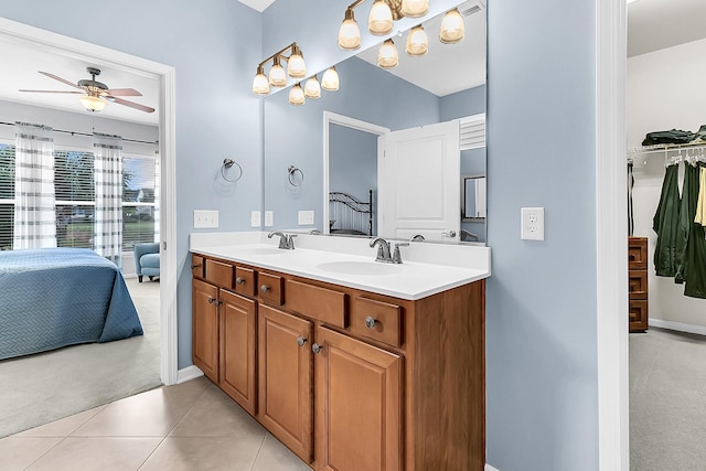 bathroom featuring ceiling fan, tile patterned floors, and vanity