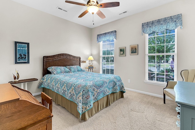 bedroom with ceiling fan and carpet flooring