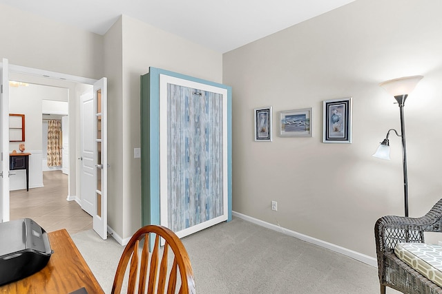 living area with light colored carpet