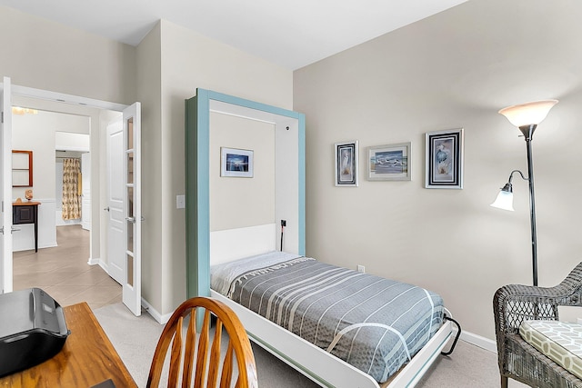 bedroom featuring light tile patterned floors