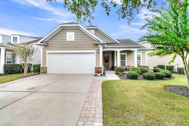 view of front of house with a front lawn and a garage