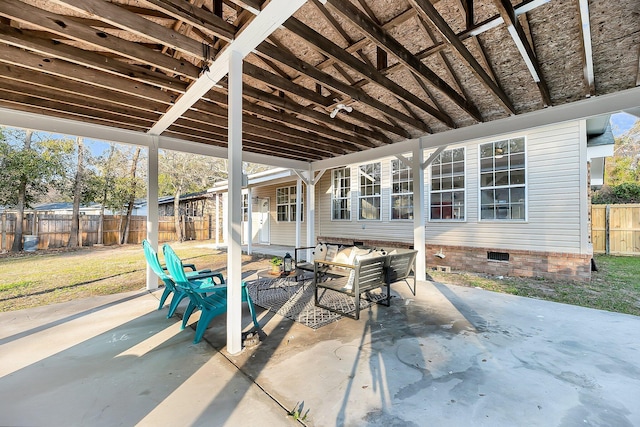 view of patio featuring fence and an outdoor hangout area