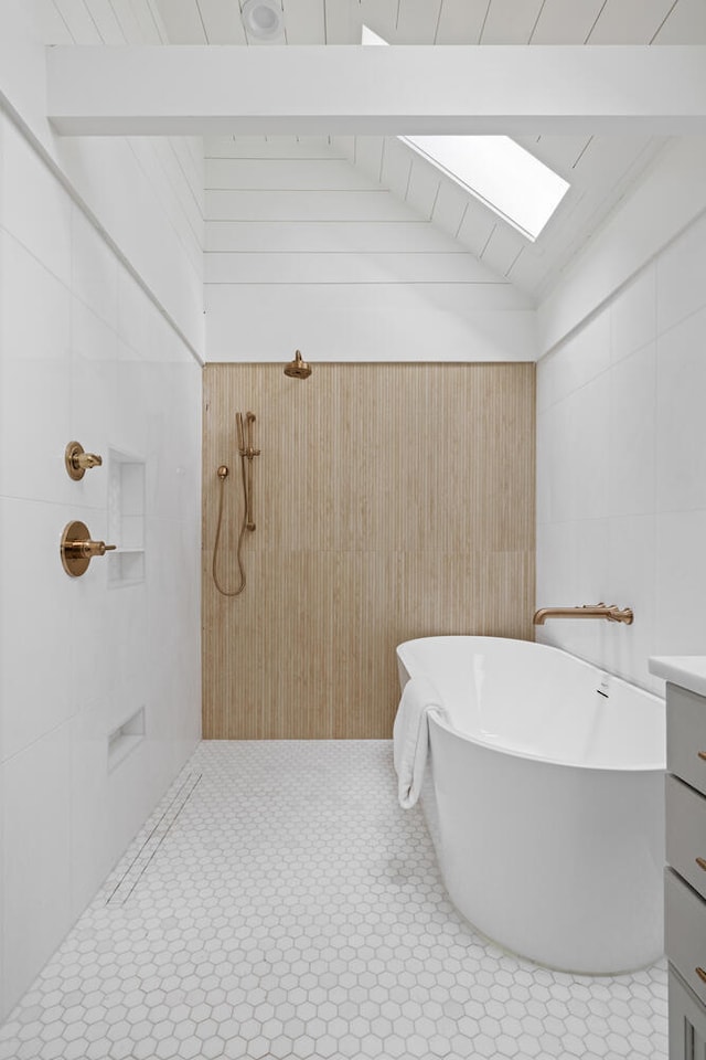 bathroom with vanity, lofted ceiling with skylight, shower with separate bathtub, and wood walls