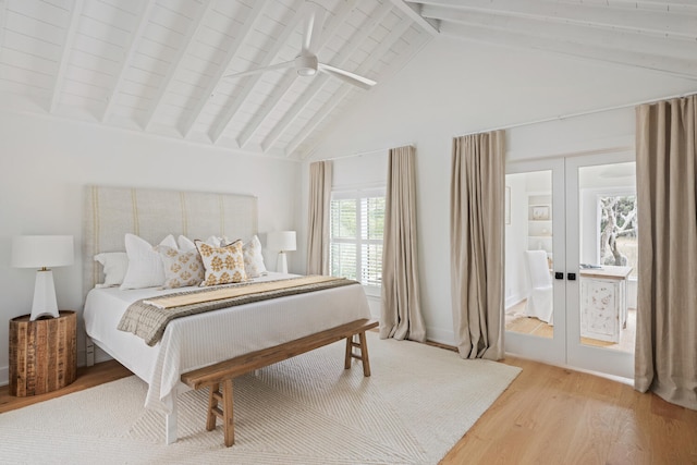 bedroom featuring beamed ceiling, french doors, ceiling fan, and light hardwood / wood-style flooring