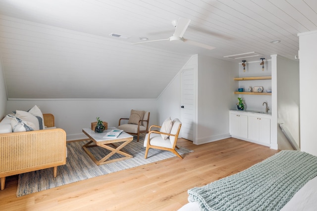 living area featuring lofted ceiling, sink, ceiling fan, wooden ceiling, and light wood-type flooring