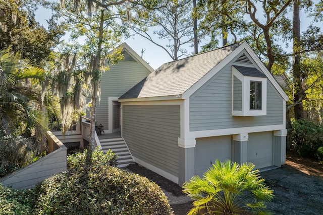 view of side of property with a garage