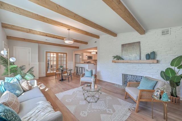 32 Briarcliff Dr, Charleston, SC 29407 - living area with light wood finished floors, a wainscoted wall, and beamed ceiling