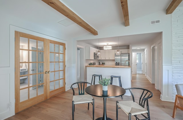32 Briarcliff Dr, Charleston, SC 29407 - dining area featuring beam ceiling, light wood finished floors, and french doors
