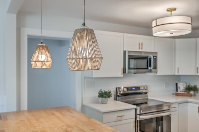 32 Briarcliff Dr, Charleston, SC 29407 - kitchen with appliances with stainless steel finishes, pendant lighting, and white cabinetry