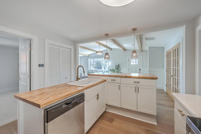 32 Briarcliff Dr, Charleston, SC 29407 - kitchen featuring stainless steel dishwasher, a sink, butcher block counters, light wood-style floors, and beam ceiling