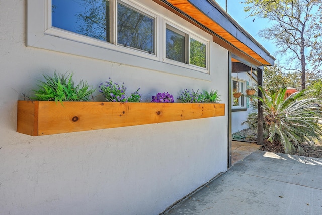 32 Briarcliff Dr, Charleston, SC 29407 - view of side of property with stucco siding and a patio area