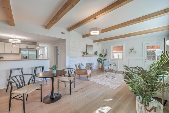 32 Briarcliff Dr, Charleston, SC 29407 - dining room with light wood-type flooring, beamed ceiling, and wainscoting