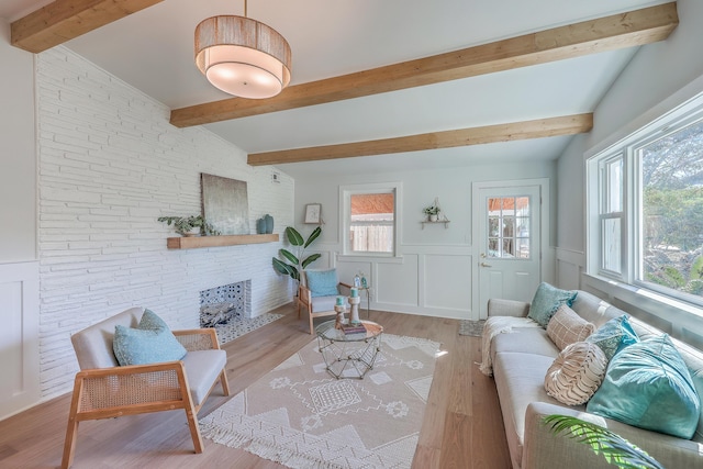 32 Briarcliff Dr, Charleston, SC 29407 - living area with light wood finished floors, wainscoting, beamed ceiling, and a fireplace