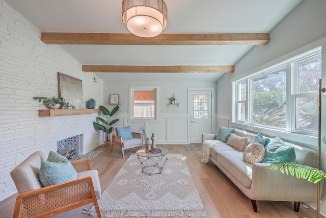 32 Briarcliff Dr, Charleston, SC 29407 - living room featuring light wood-style flooring, wainscoting, and a fireplace