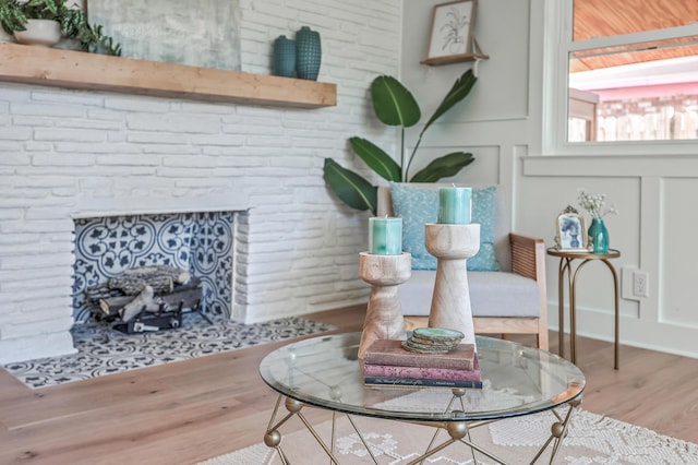 32 Briarcliff Dr, Charleston, SC 29407 - detailed view of a brick fireplace, wood finished floors, and a decorative wall
