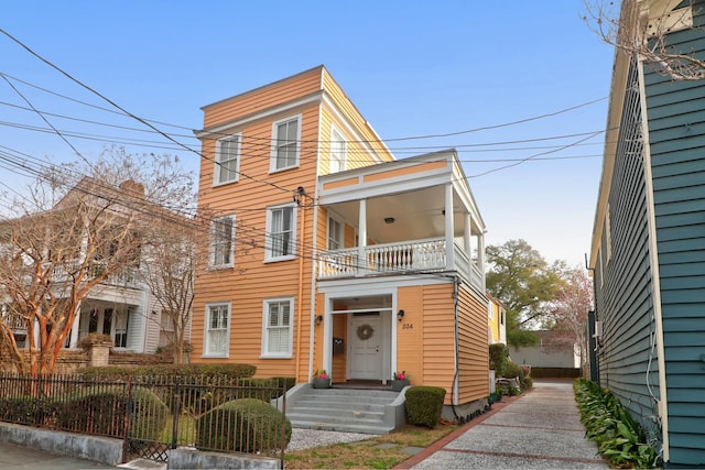 view of front of house featuring a balcony