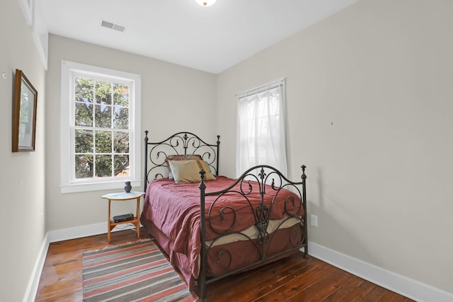 bedroom featuring dark wood-type flooring