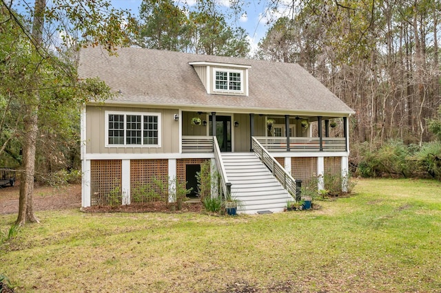 view of front facade with covered porch and a front yard