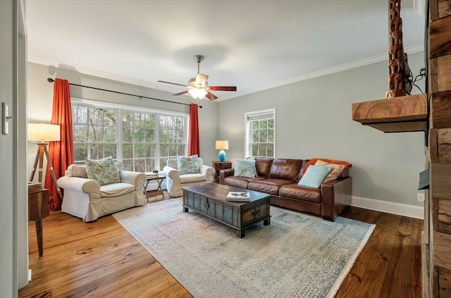 living room featuring ceiling fan, crown molding, and hardwood / wood-style flooring