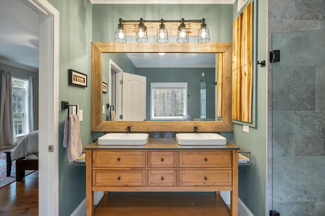 bathroom with walk in shower, vanity, ornamental molding, and a healthy amount of sunlight