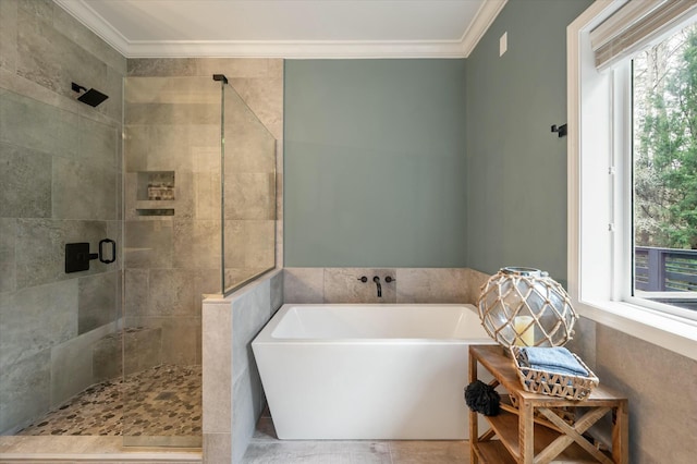 bathroom featuring crown molding and separate shower and tub