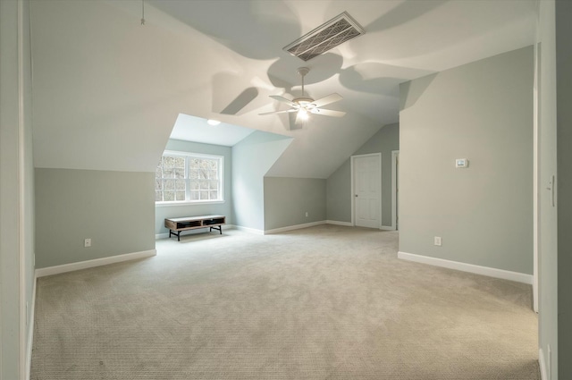 additional living space with light carpet, ceiling fan, and lofted ceiling