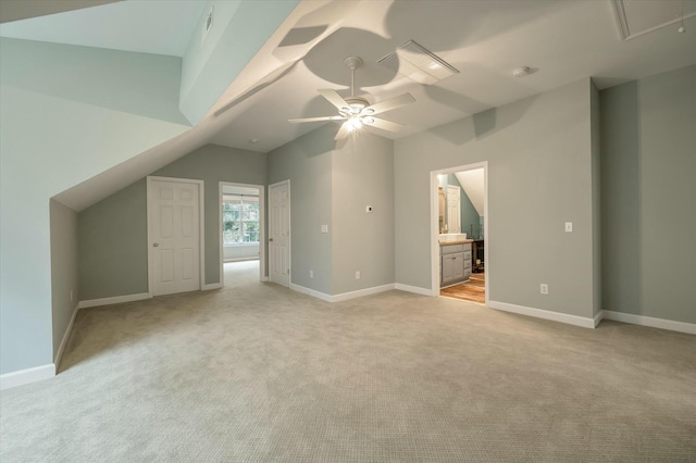 bonus room featuring light carpet, ceiling fan, and vaulted ceiling