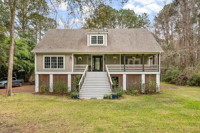 view of front of home with a porch and a front yard