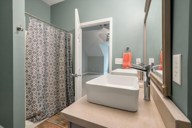 bathroom with wood-type flooring and sink