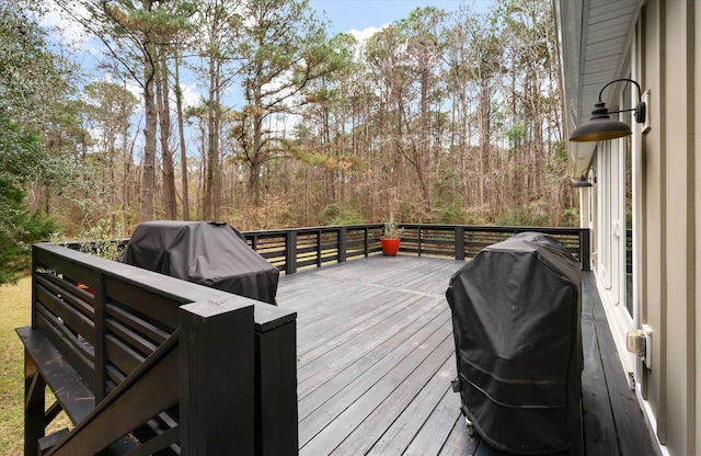 wooden deck featuring grilling area