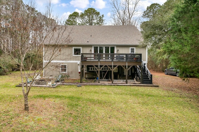 back of house featuring a yard and a wooden deck