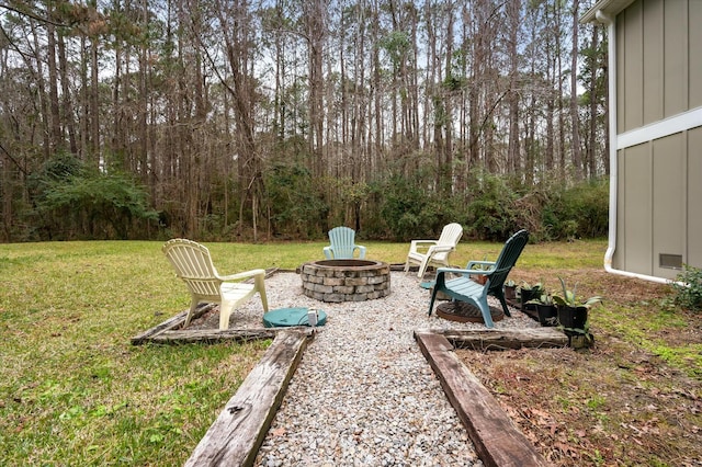 view of yard with an outdoor fire pit