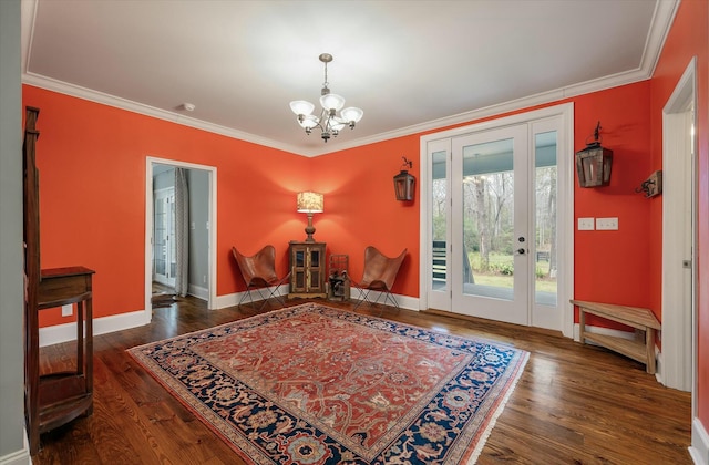 interior space featuring dark hardwood / wood-style flooring, crown molding, and a notable chandelier