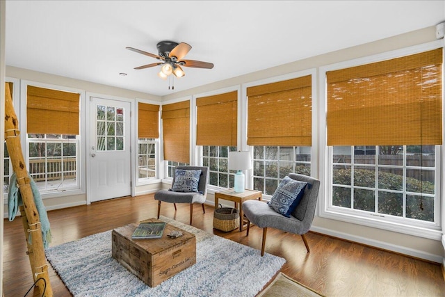 interior space with ceiling fan