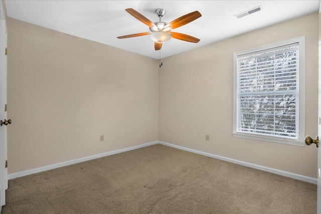 empty room with carpet floors and ceiling fan