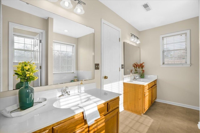 bathroom with tile patterned flooring and vanity