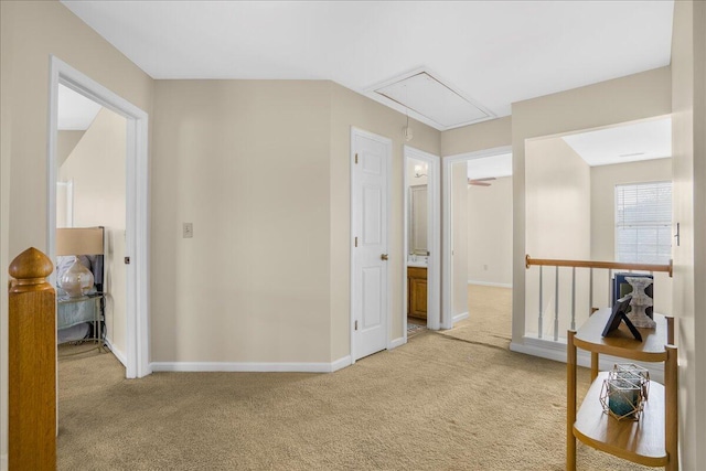 hallway with light colored carpet