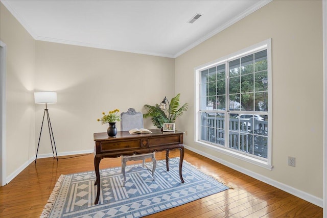 office with ornamental molding and hardwood / wood-style floors