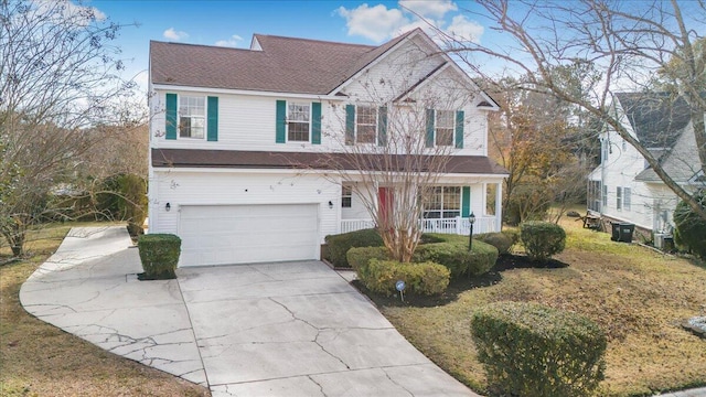 view of front of property with a garage and a porch