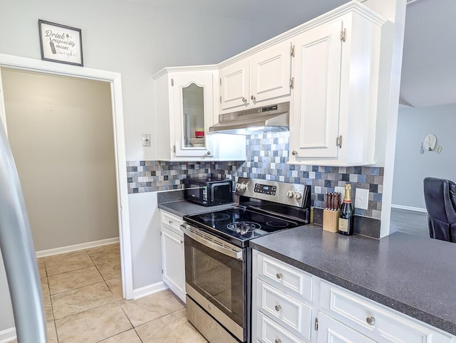 5 Drummond Ct, Charleston, SC 29414 - kitchen featuring electric range, under cabinet range hood, dark countertops, white cabinetry, and tasteful backsplash