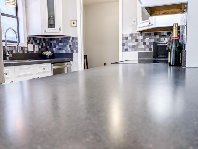5 Drummond Ct, Charleston, SC 29414 - kitchen with tasteful backsplash, white cabinets, glass insert cabinets, and a sink