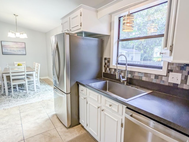 5 Drummond Ct, Charleston, SC 29414 - kitchen with appliances with stainless steel finishes, a chandelier, dark countertops, a sink, and tasteful backsplash