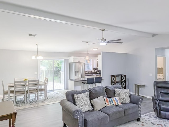 5 Drummond Ct, Charleston, SC 29414 - living room featuring a ceiling fan, light wood-style flooring, a chandelier, and baseboards