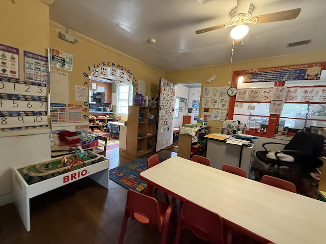 715 Yew St, Charleston, SC 29407 - dining area featuring ornamental molding, ceiling fan, and wood finished floors