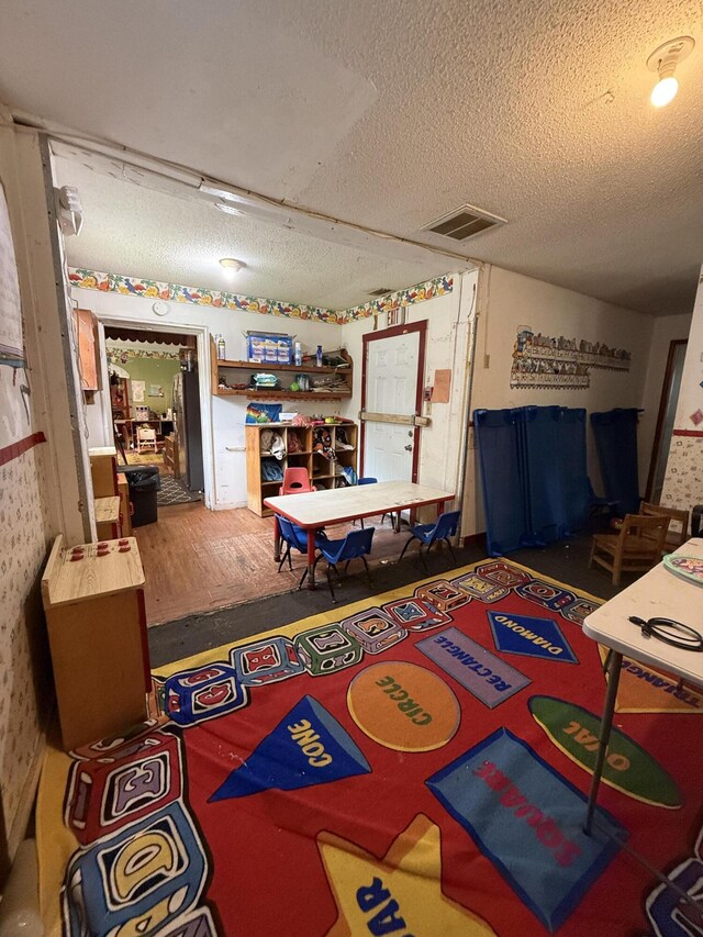 715 Yew St, Charleston, SC 29407 - playroom with a textured ceiling