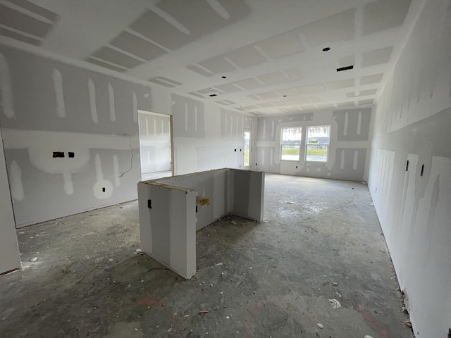 kitchen featuring visible vents, open floor plan, white cabinetry, and a kitchen island
